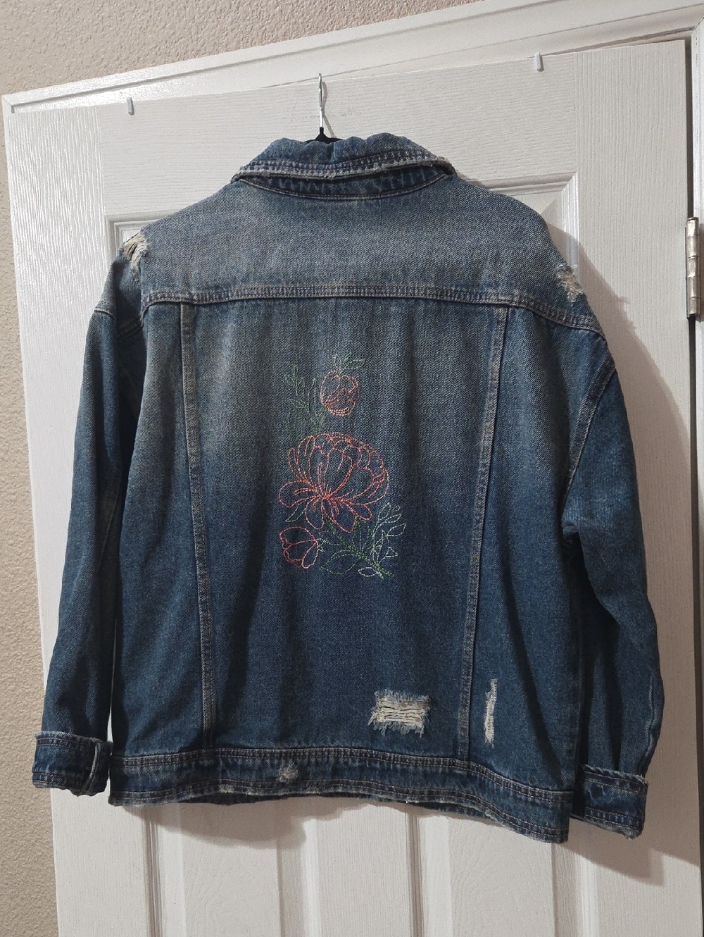 No Boundaries Denim Jacket with Hand Embroidary On Back. Distressed Denim